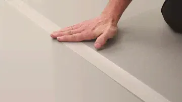 How to install a Harlequin vinyl performance floor using top tape